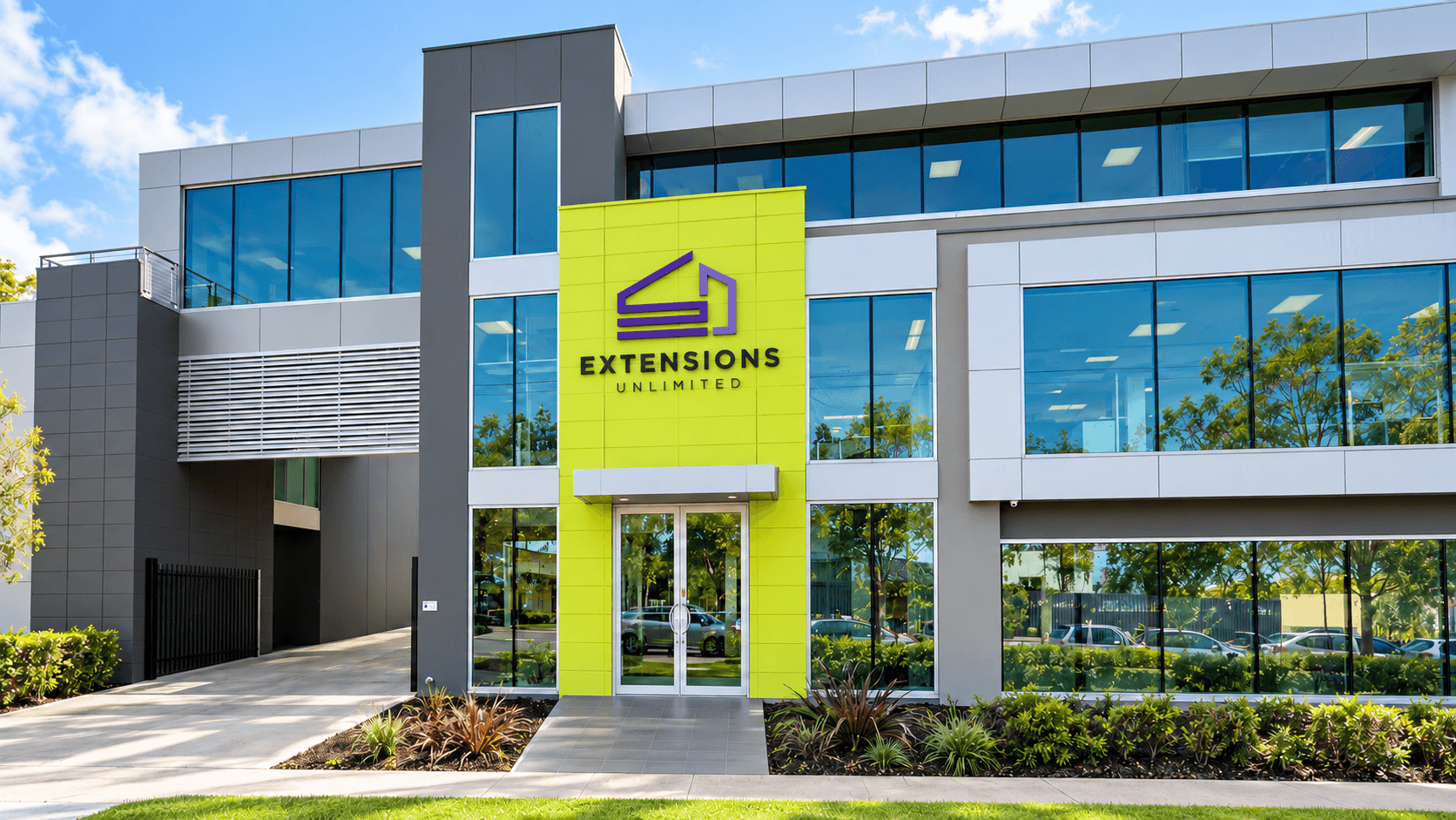Extensions Unlimited office exterior with purple logo above the entrance