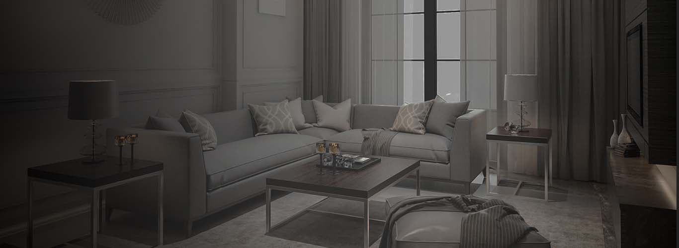 Living room with a sofa, coffee table and tall windows